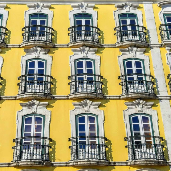 Yellow Buildings in Lisbon, Portugal. Image by Lisbon with Pats.