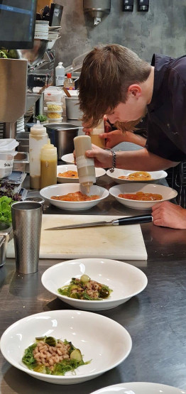 Kitchen team preparing the starter at Paal 15 on Texel, Netherlands.